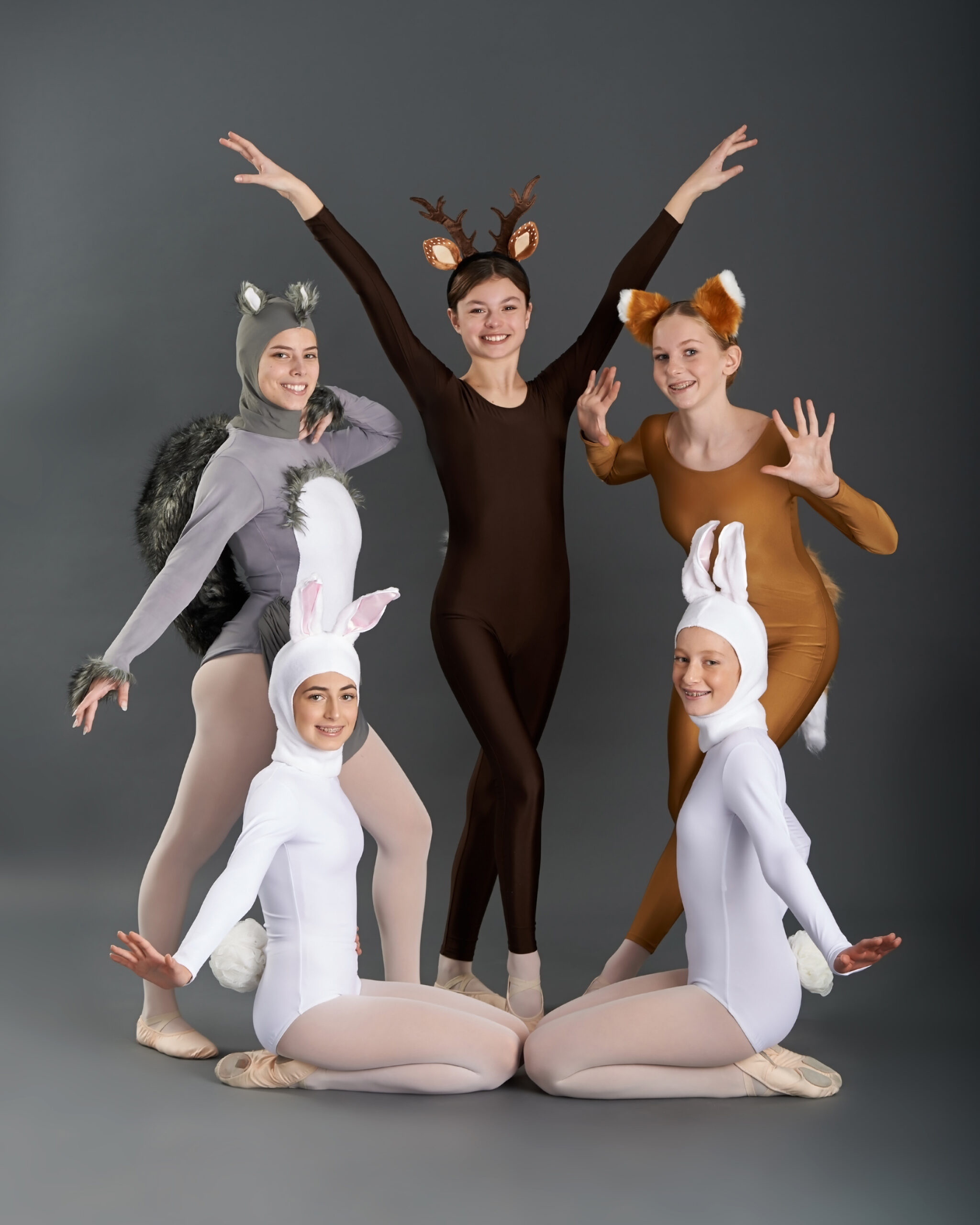 dance ensemble dancers posing in animal costumes